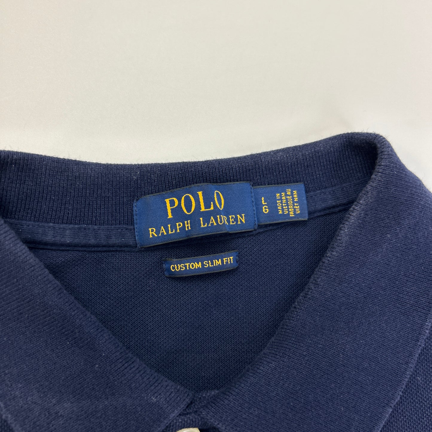 Ralph Lauren Polo (L)